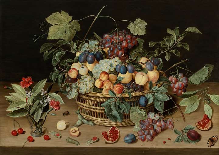 Still Life of a Wicker Basket of Fruit on a Wooden Table